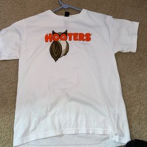 This is a white Hooters shirt